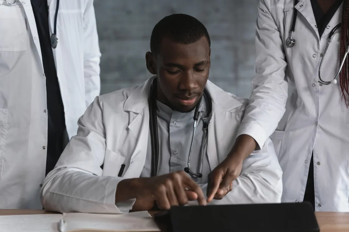 Medical colleagues reviewing information together at a desk